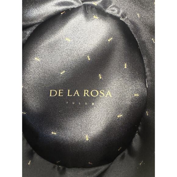 De La Rosa Tulum Hat features a soft, light-colored suede finish and a gold pin.